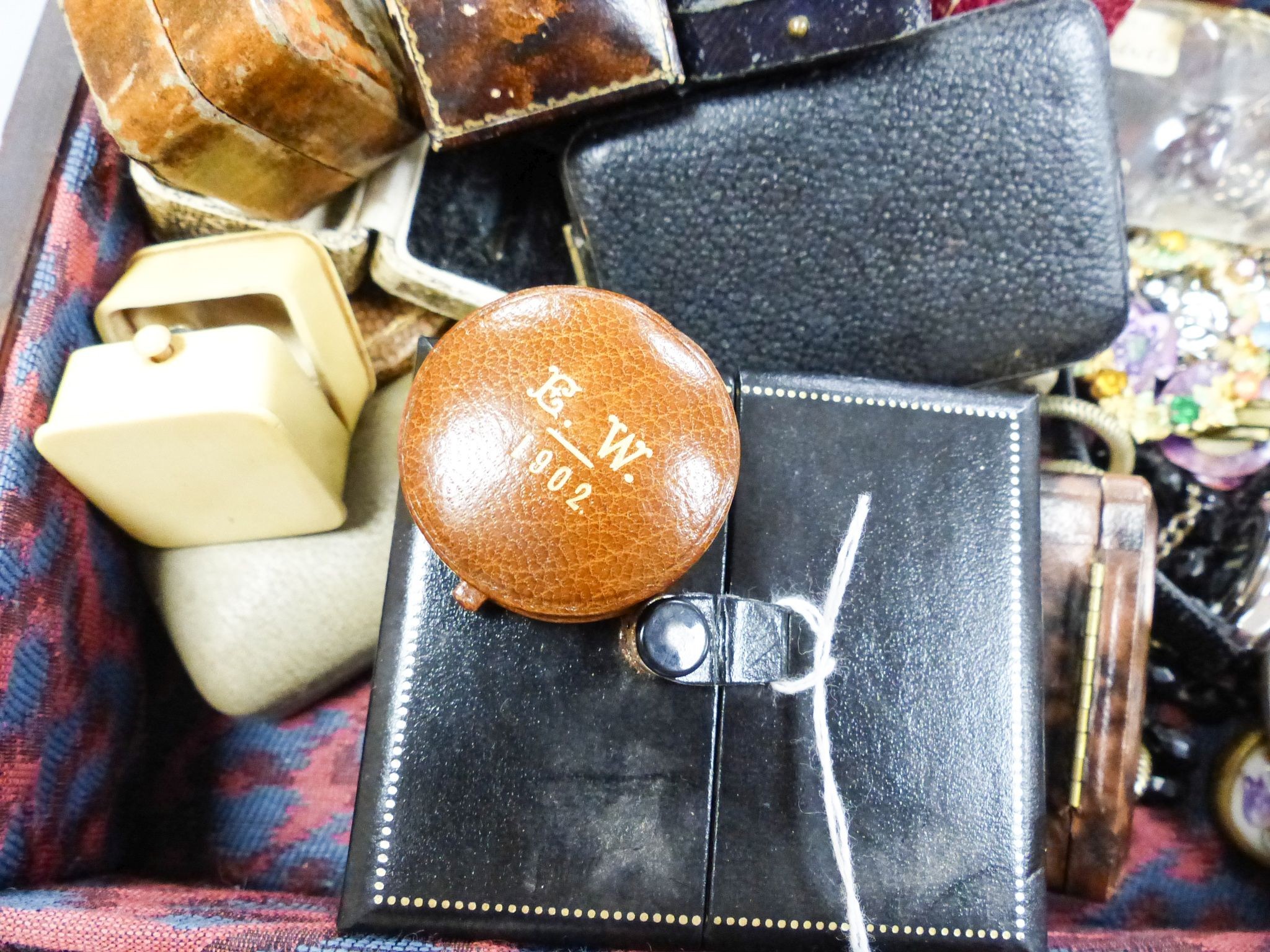 A small quantity of costume jewellery and jewellery boxes, in a mahogany work box.